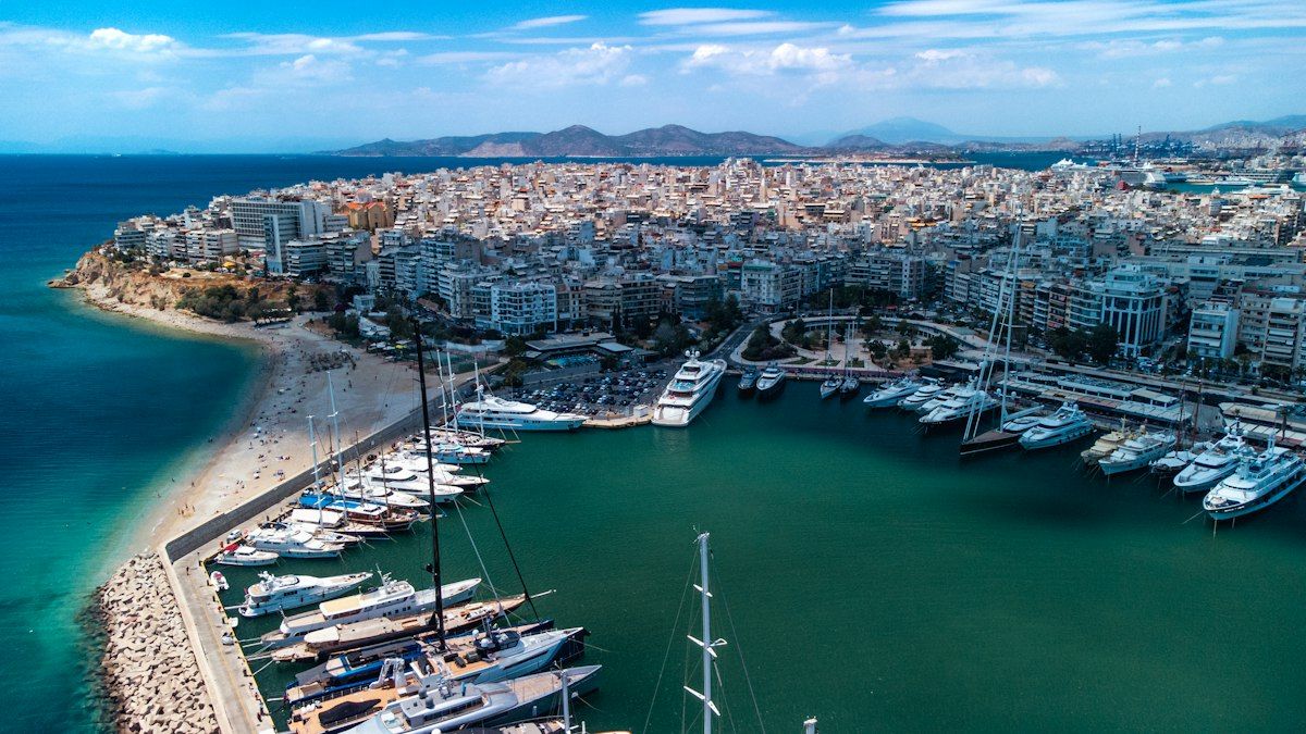 Piraeus from the air: the yacht marina and breakwater, the city, and the sea beyond